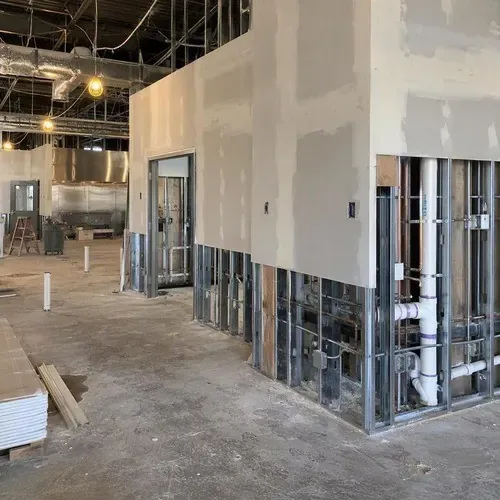 Restaurant build out with partial drywall and plumbing on a commercial drywall project in Kingston, ON