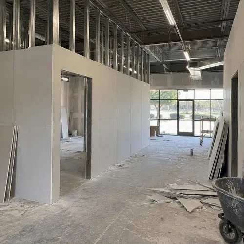Retail unit drywall partitions under construction on a commercial drywall project in Kingston, ON