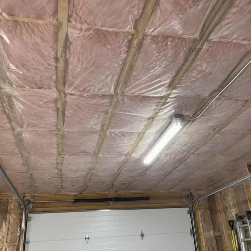 Insulated garage ceiling ready for drywall during insulation and drywall work in Kingston, ON