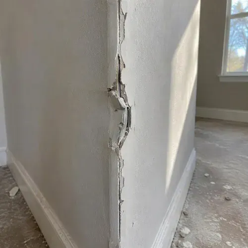 Dented corner bead popped on outside corner on a drywall repair job in Kingston, ON