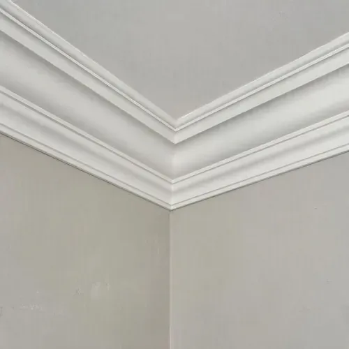 Restored decorative plaster crown moulding corner during plaster crown moulding repair in Kingston, ON