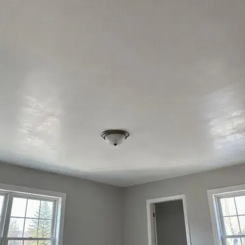 Smooth skim coated ceiling after popcorn removal during popcorn ceiling removal in Kingston, ON