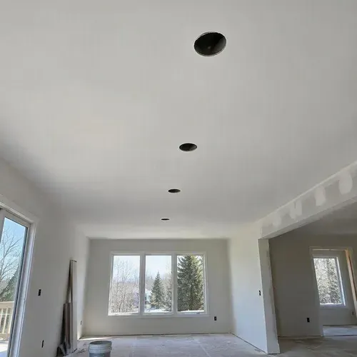 Sanded primed ceiling ready for new fixtures during pot light hole repair in Kingston, ON