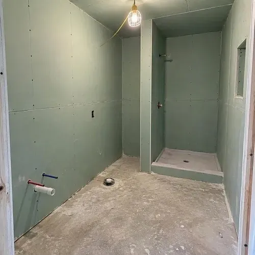 Ensuite bathroom finished in moisture resistant board on a residential drywall installation in Kingston, ON