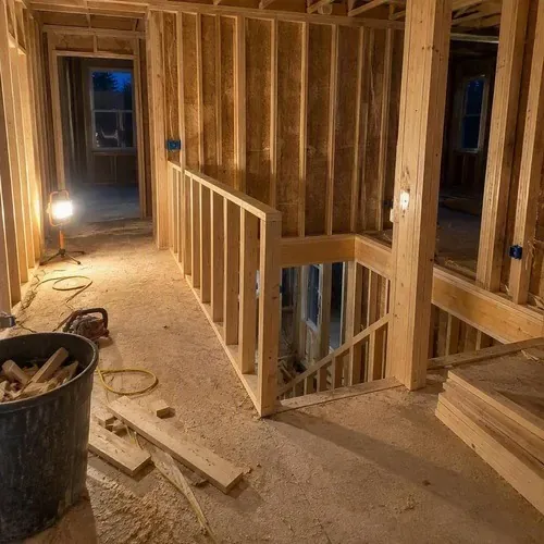 Framed landing and open stairwell ready for drywall in a South Frontenac home