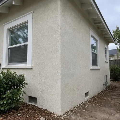 Blended stucco repair on a bungalow corner on a stucco repair job in the Kingston area