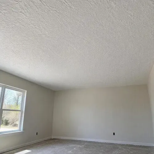 Primed textured ceiling after completed repair during textured ceiling and wall repair in Kingston, ON