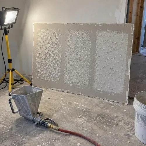 Texture test panel on a drywall scrap during textured ceiling and wall repair in Kingston, ON