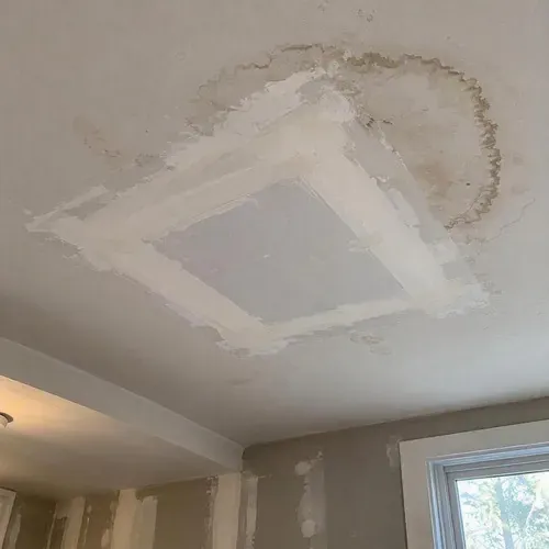 Replacement ceiling drywall sheet taped and ready for texture during a Kingston ceiling repair